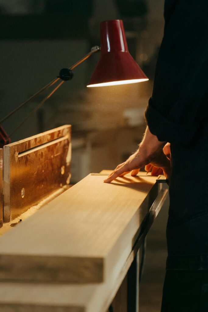 person working on custom carpentry in workshop