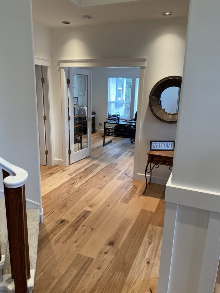 Floor installed in hallway by North Pacific Flooring